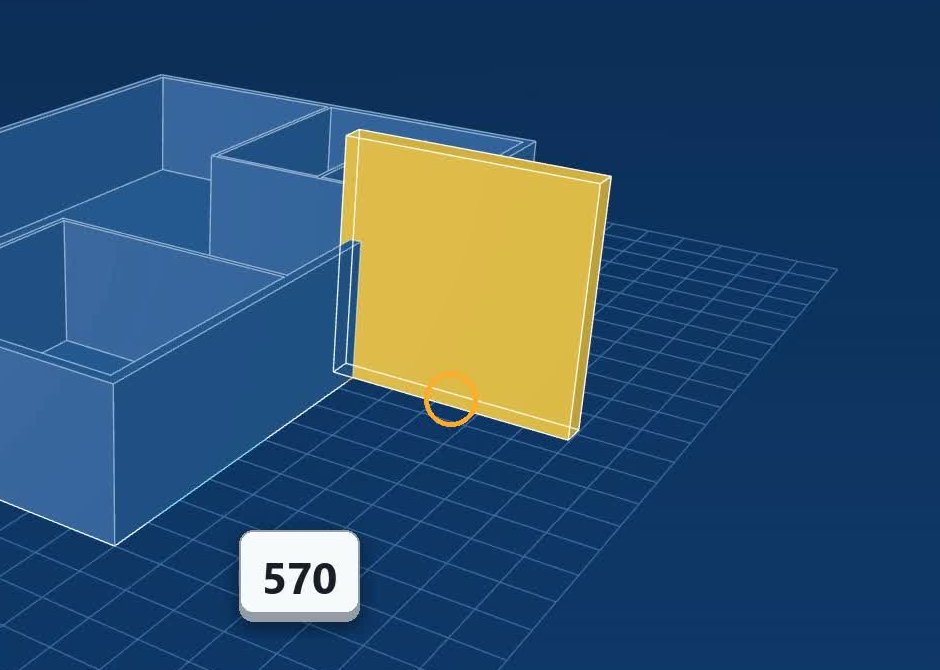 FlatCad 3D showing the villa's ground-floor walls in translucent blue on a grid, with a yellow box standing against one wall while its size is typed in, the value 570 shown in a key-press badge