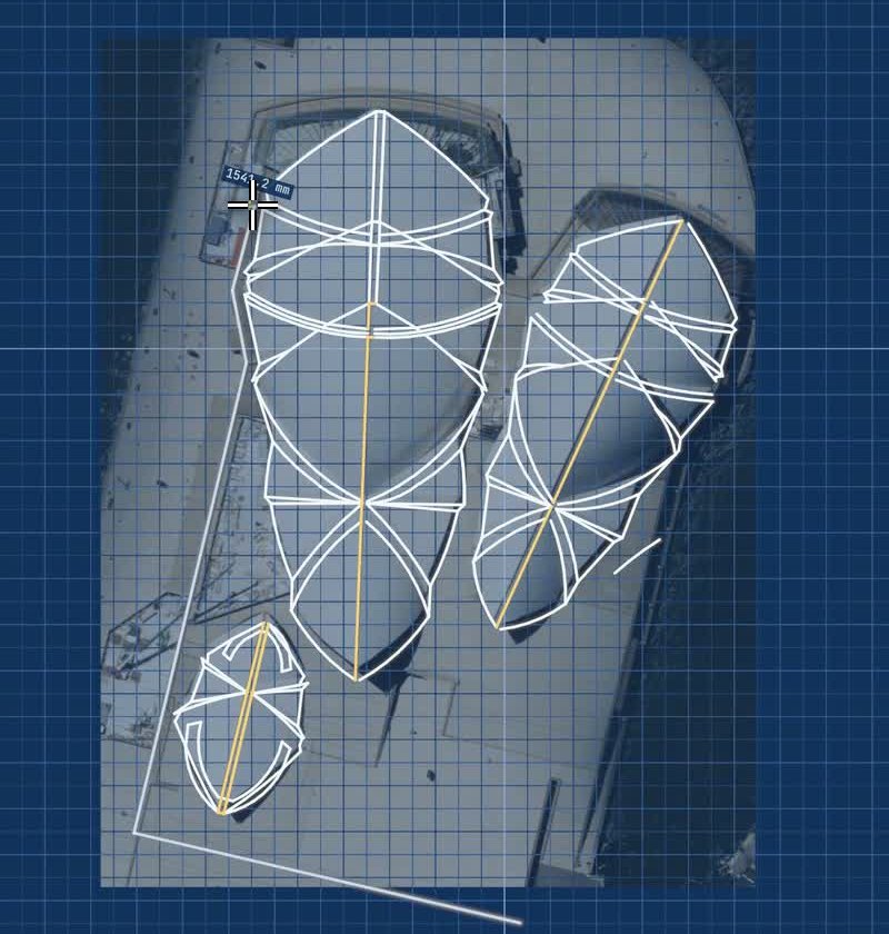 FlatCad 2D on its blueprint theme with an aerial photo of the Sydney Opera House under the drawing, white traced lines and arcs over the shells of all three halls, and the yellow ridge lines used as mirror axes